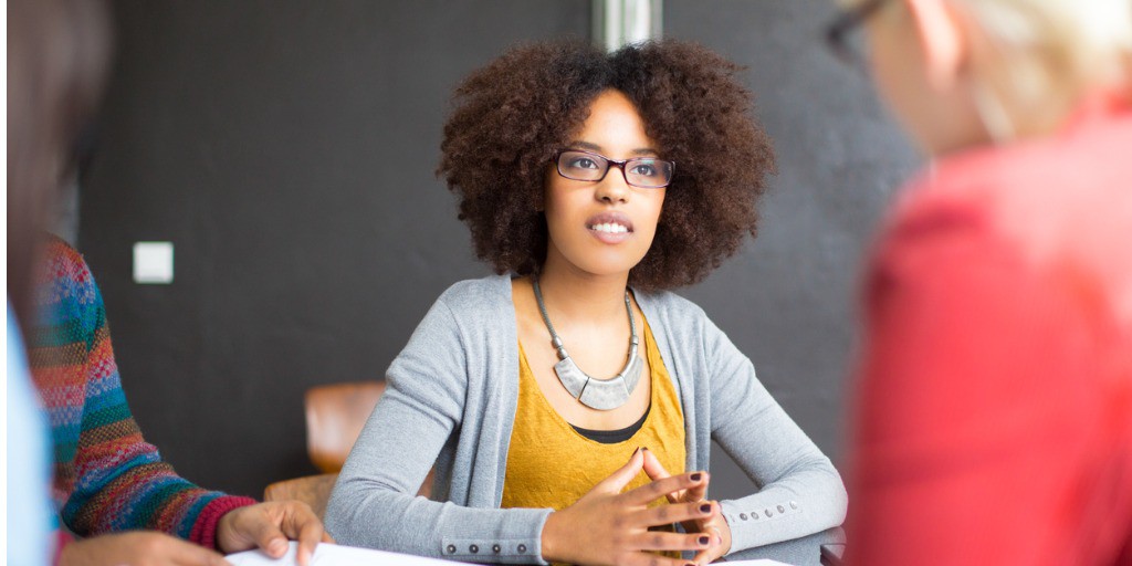 business-woman-discussing-profits-with-her-colleagues-picture-id522225823