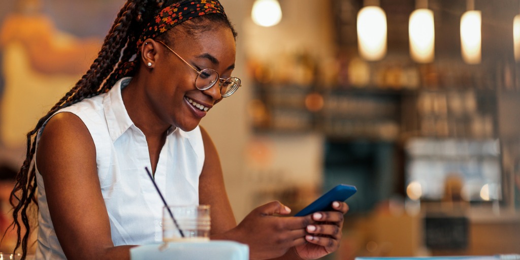 black-woman-using-cellphone-at-cafe-picture-id1349052875 Mobile training solutions offer respite – both to the traveling educator and to franchising executives tasked with building consistent onboarding experiences.