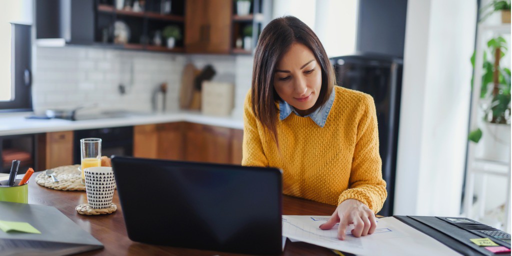 young-business-entrepreneur-woman-working-at-home-while-having