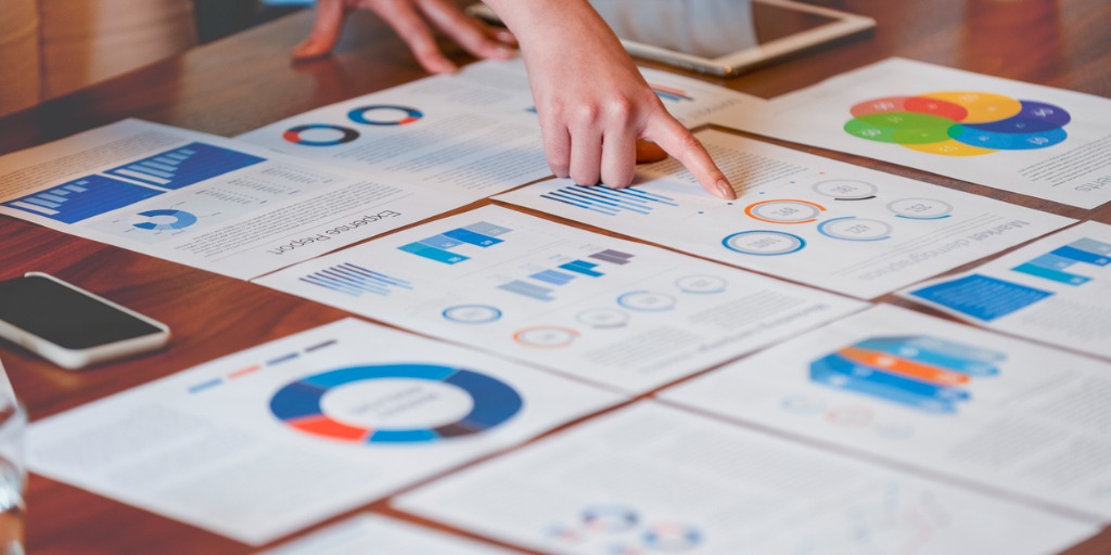 paperwork-and-hands-on-a-board-room-table-at-a-business-presentation-picture-id1133887502 Financial statements are prepared according to the double-entry system. This is a system that accountants use to record transactions.