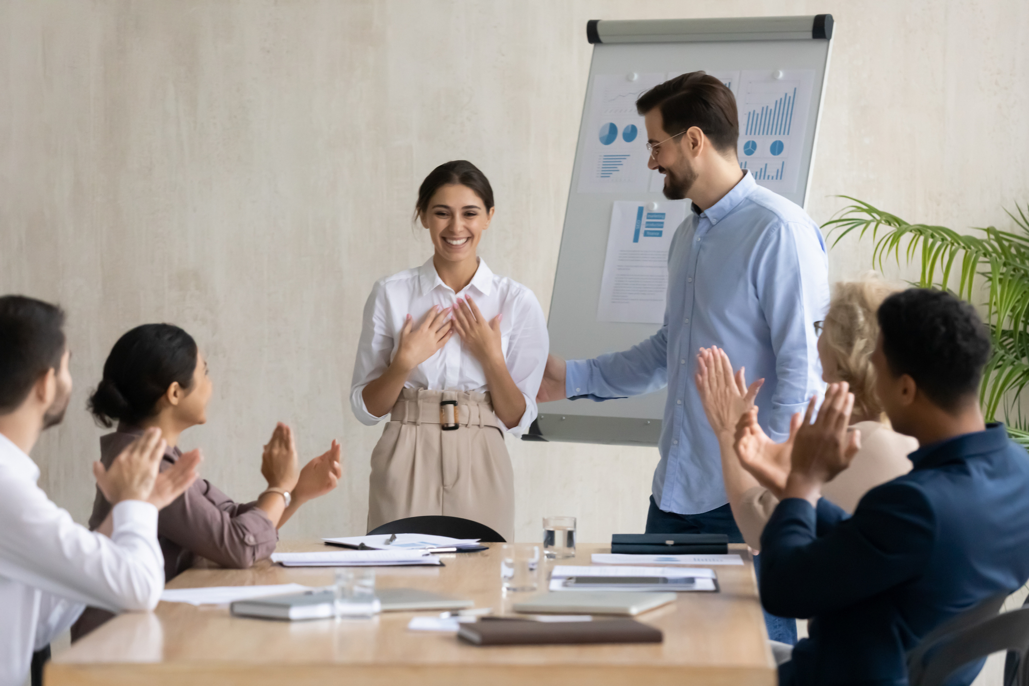 Businessman introduce excited female newcomer to team Businessman introduce excited female newcomer to team