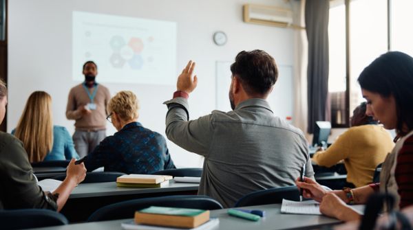 In the early 2000s, many graduate programs were heavily classroom-based, often centralized, operating in a context where access to structured financial knowledge itself carried weight.